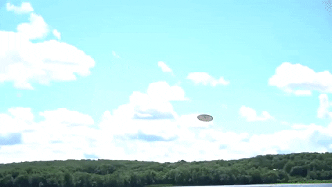 Man Catches Frisbee In The Sea GIF