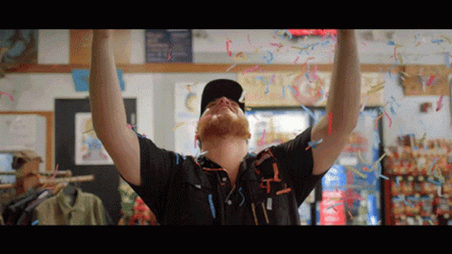 Man Celebrating with Confetti and Streamers