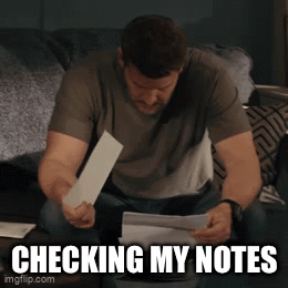 Man Checking Notes on Bed