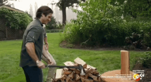 Man Chopping Wood in Yard Saying Destination Romance
