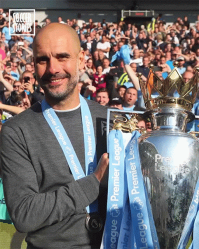 Man City Coach Pep Guardiola Holding Trophy GIF