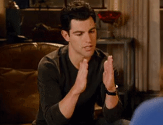 Man Clapping Hands in Living Room