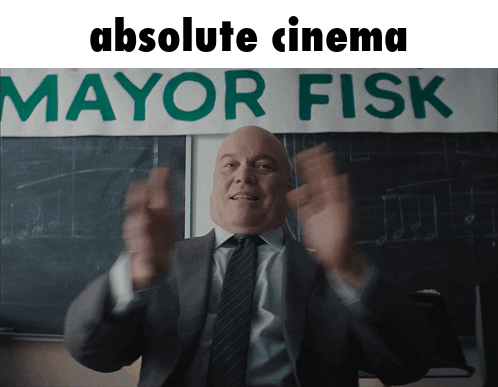 Man Clapping in Front of Absolute Cinema Sign