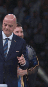 Man Clapping with Medal Around Neck