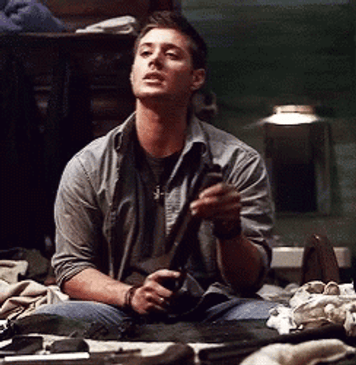 Man Cleaning Shotgun GIF