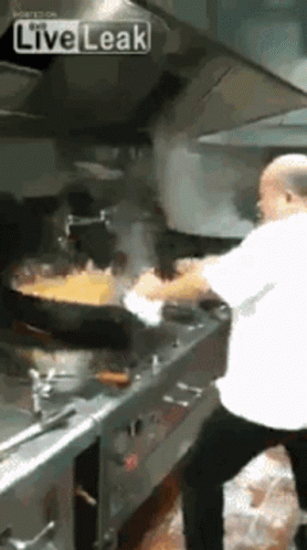 Man Cooking Food in Kitchen