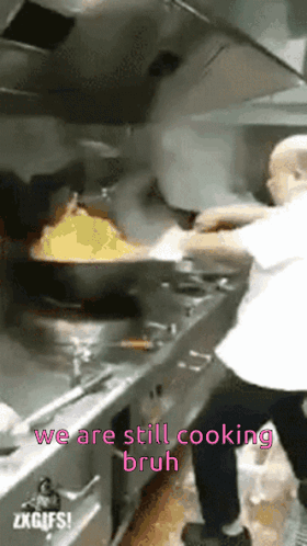 Man Cooking in Kitchen We Are Still Cooking Bruh