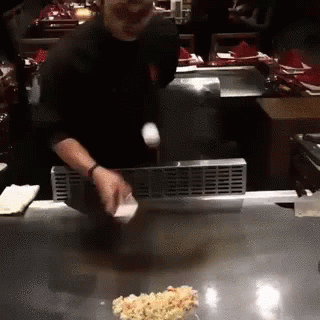 Man Cooking on Grill in Kitchen
