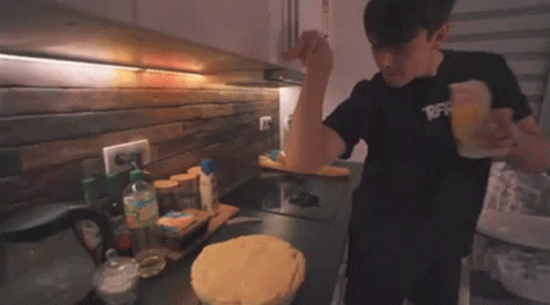 Man Cooking Pie in Kitchen