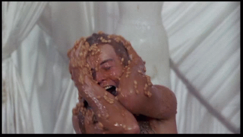 Man Covered In Peanut Butter And Nuts GIF