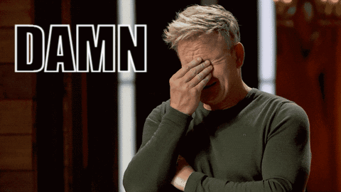 Man Covering Face In Front Of Damn Sign GIF