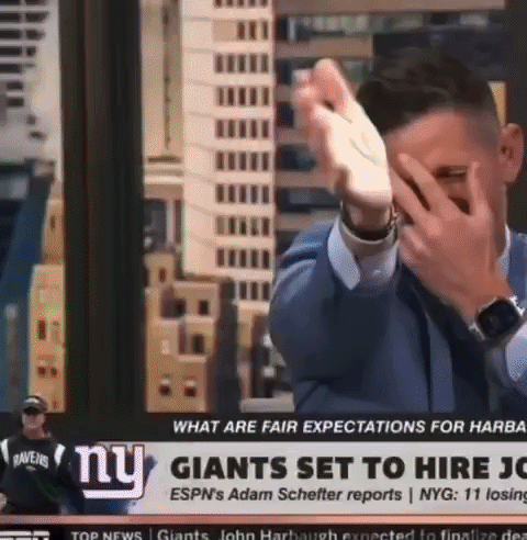 Man Covering Face in Front of NY Giants Headline