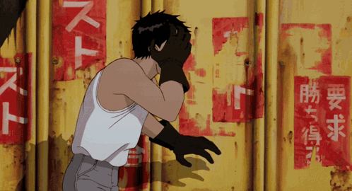 Man Covering Face In Front Of Wall With Chinese Writing GIF
