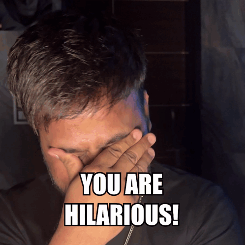Man Covering Face With Hand Saying You Are Hilarious