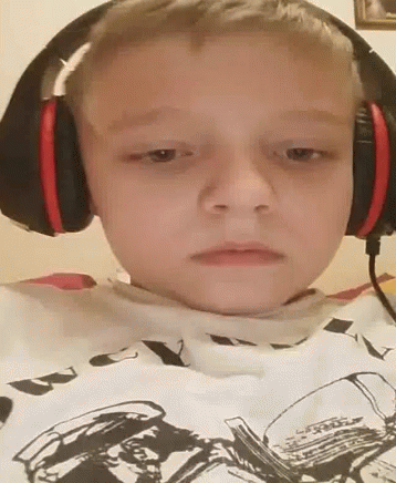 Man Covering Face with Headphones
