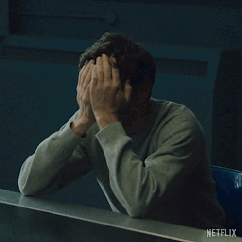 Man Covering Face with Netflix Logo