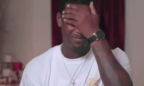 Man Covering Face With Watch And Necklace GIF