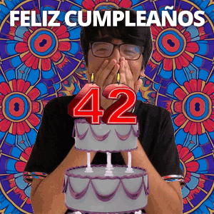 Man Covering Mouth In Front Of Birthday Cake With Number 42 GIF