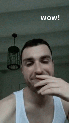 Man Covering Mouth Saying Wow GIF