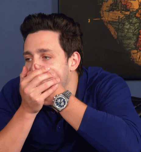 Man Covering Mouth with Hands