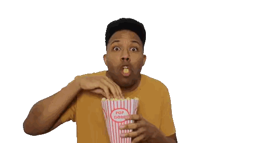 Man Covering Mouth With Popcorn Bucket
