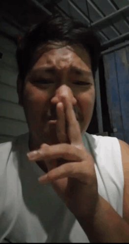Man Covering Nose