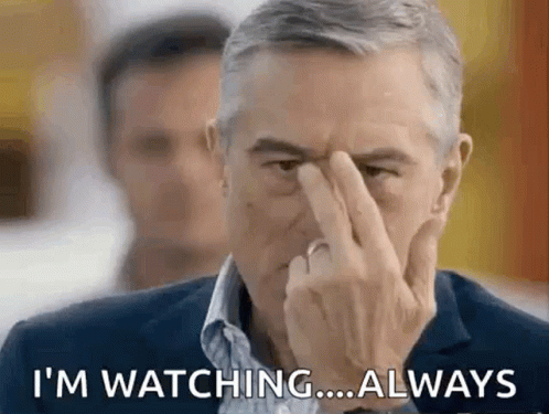 Man Covering Nose Saying I'm Watching Always