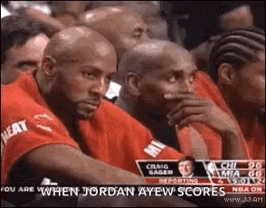 Man Covers Mouth At Basketball Game GIF