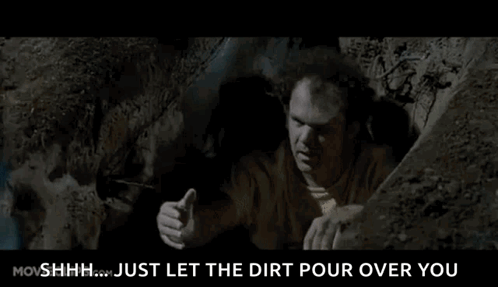Man Crawling Out of Dirt Hole