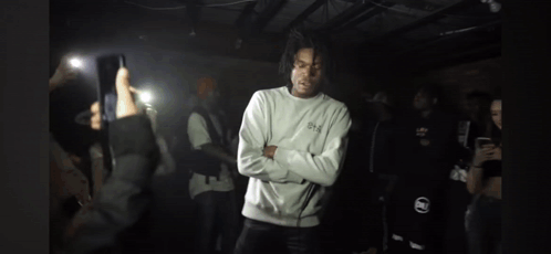 Man Crossed Arms Surrounded By People GIF