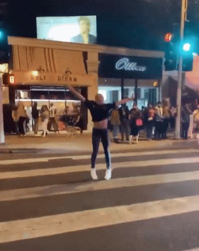 Man Crossing Street In Front Of Salt Straw Store GIF