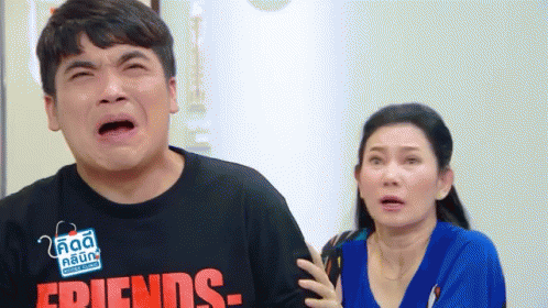 Man Crying Beside Surprised Woman GIF