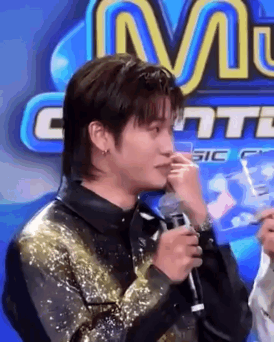 Man Crying Holding Microphone Sign M
