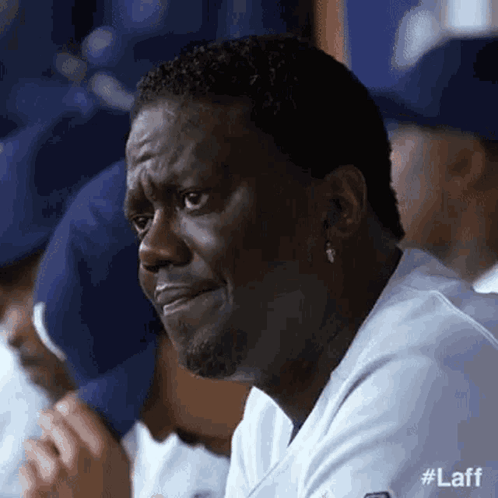 Man Crying in Dugout