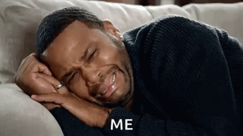 Man Crying Lying on Couch