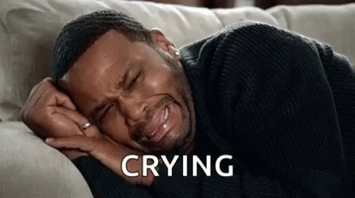 Man Crying on Couch Eyes Closed