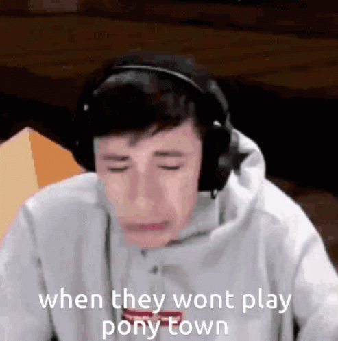 Man Crying Playing Video Game with Headphones
