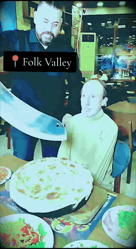 Man Cutting Pizza Saying Folk Valley