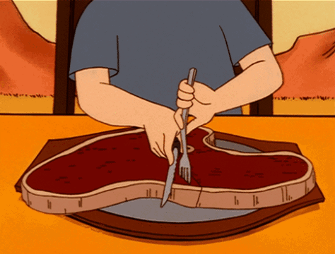 Man Cutting Steak with Knife and Fork