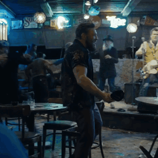 Man Dancing In Bar With The Sign GIF