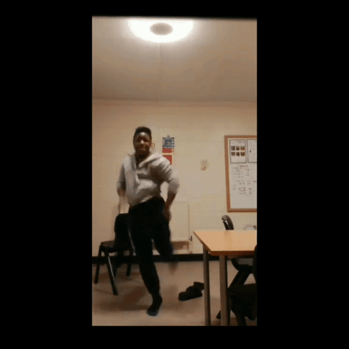 Man Dancing in Classroom