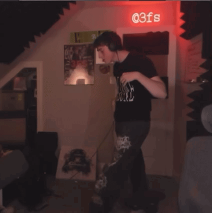 Man Dancing in Front of @ 3Fs Sign