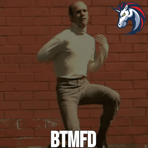 Man Dancing in Front of Brick Wall Btmfd