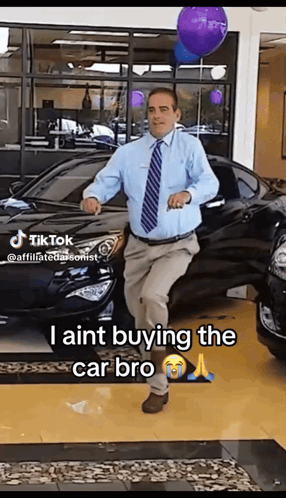 Man Dancing in Front of Car Saying I Aint Buying