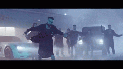 Man Dancing In Front Of Crowd And Car GIF