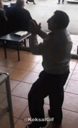 Man Dancing in Front of Crowd