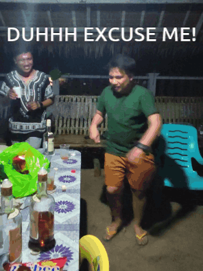 Man Dancing in Front of Duhh Excuse Me Table