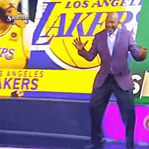 Man Dancing In Front Of Lakers Banner GIF