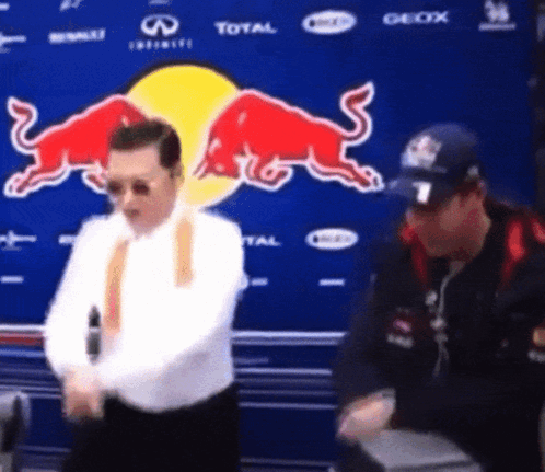 Man Dancing In Front Of Red Bull Advertisement GIF