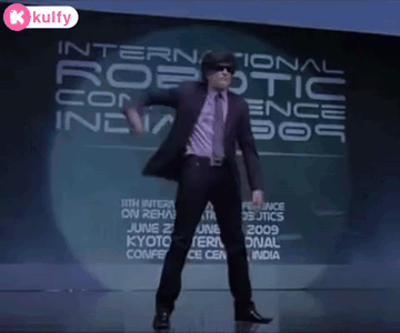 Man Dancing in Front of Robotic Conference Sign